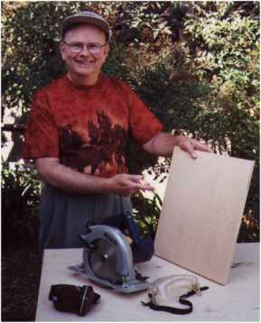 Christopher Clark with newly sawed gameboard