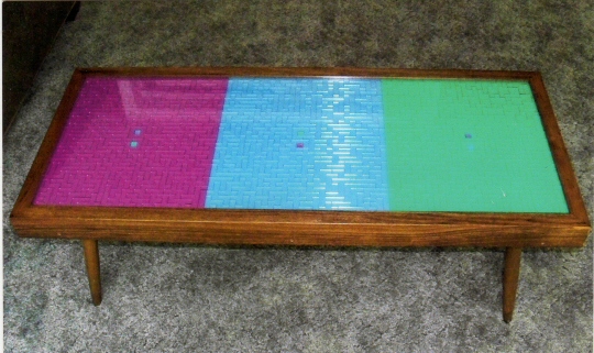 A handcrafted coffee table inlaid with the Octominoes set